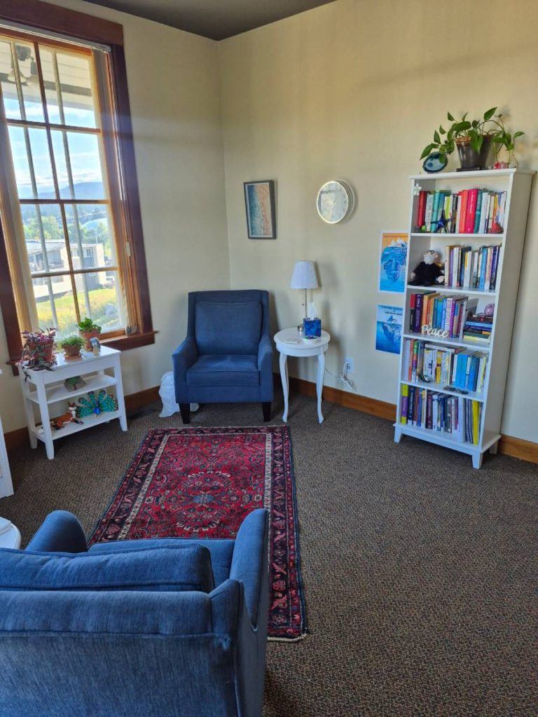 blue armchair next to a side table